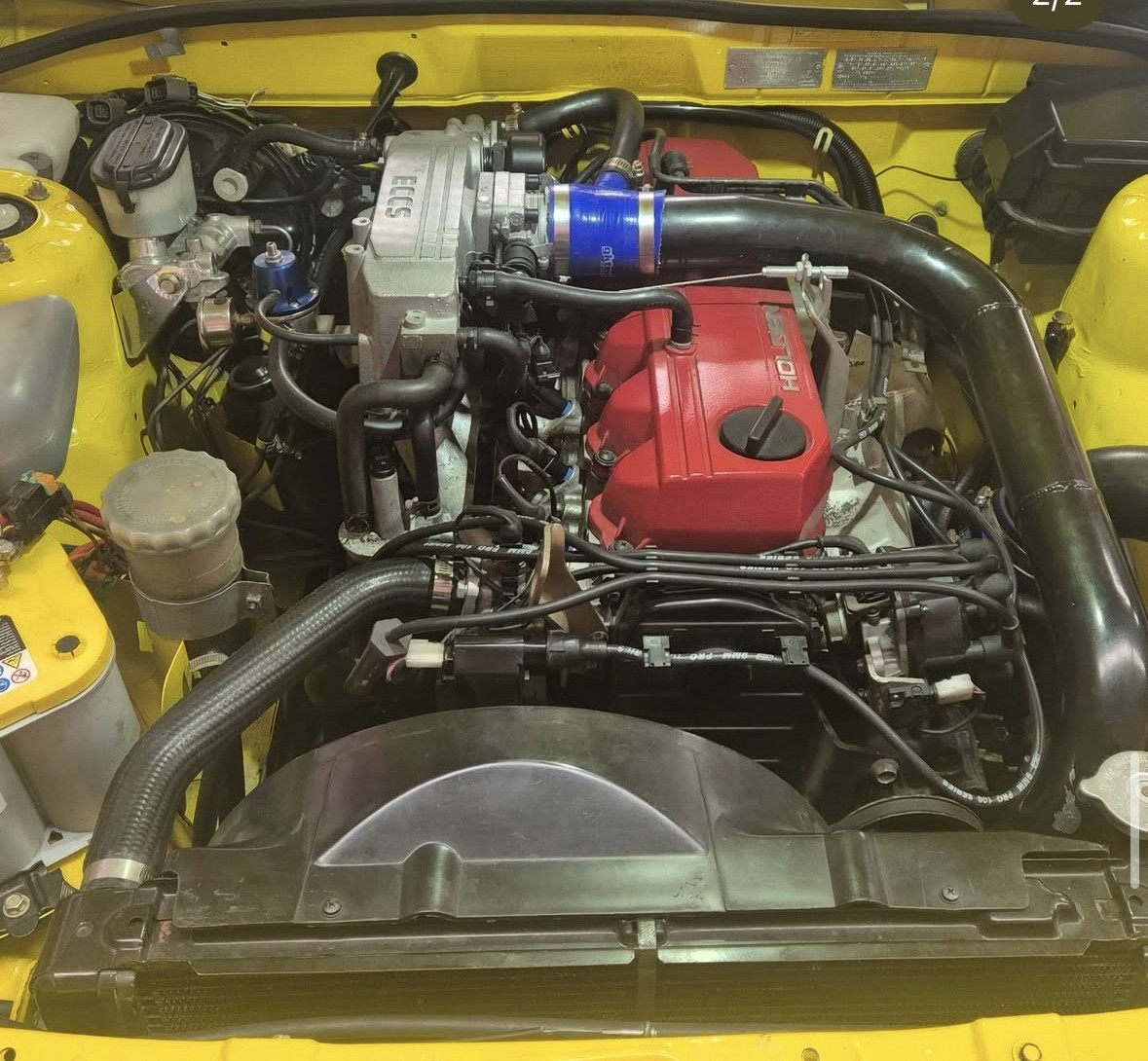 Turbocharged Holden engine bay with fabricated intake piping