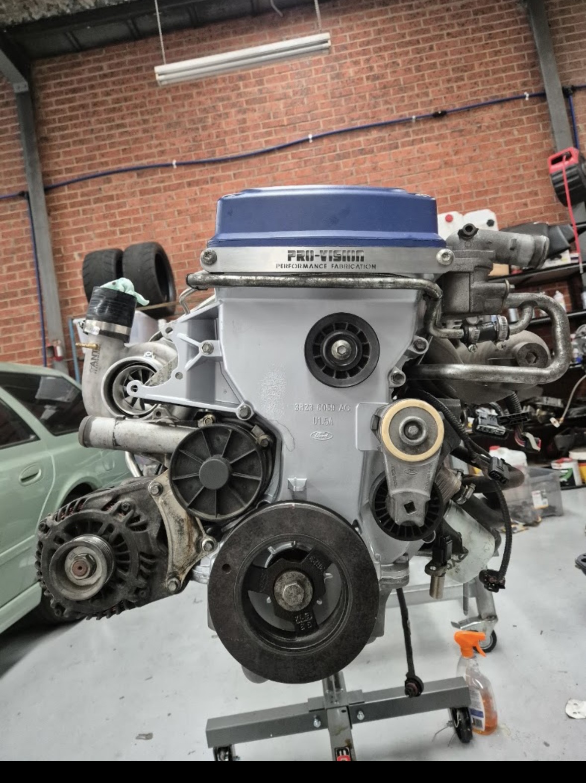 Pro-Vision turbo engine mounted on a stand in the workshop