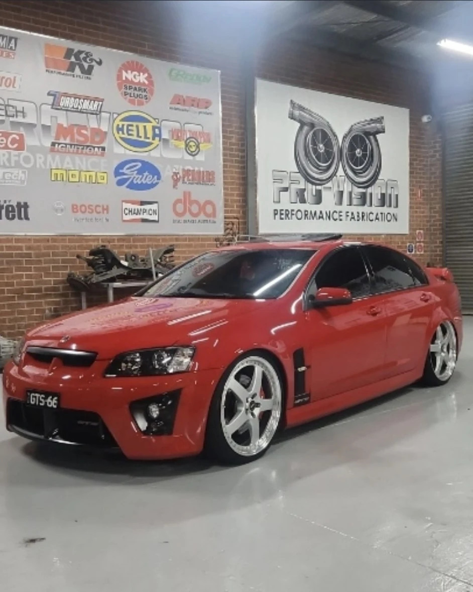Red Holden Commodore inside the Pro-Vision workshop