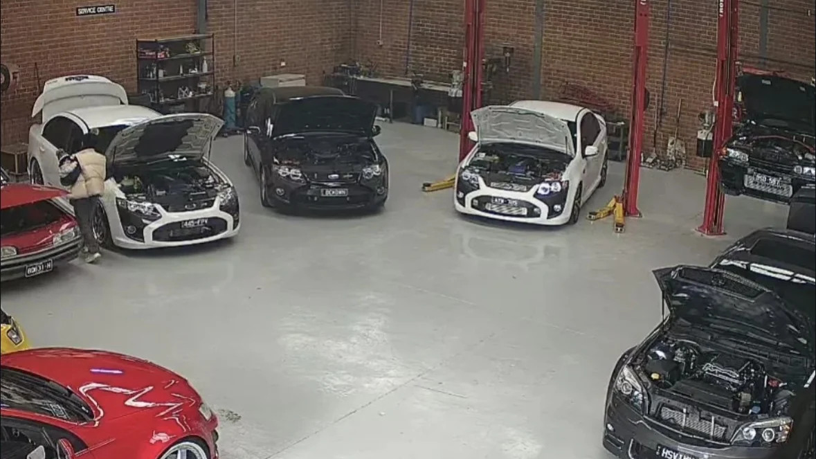 Cars being serviced inside the Pro-Vision workshop