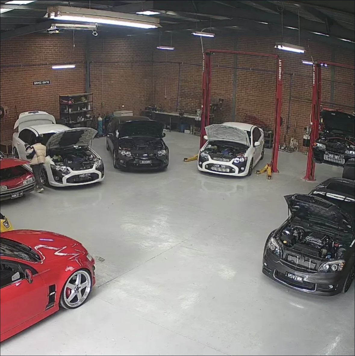 Several cars inside the Pro-Vision brick workshop